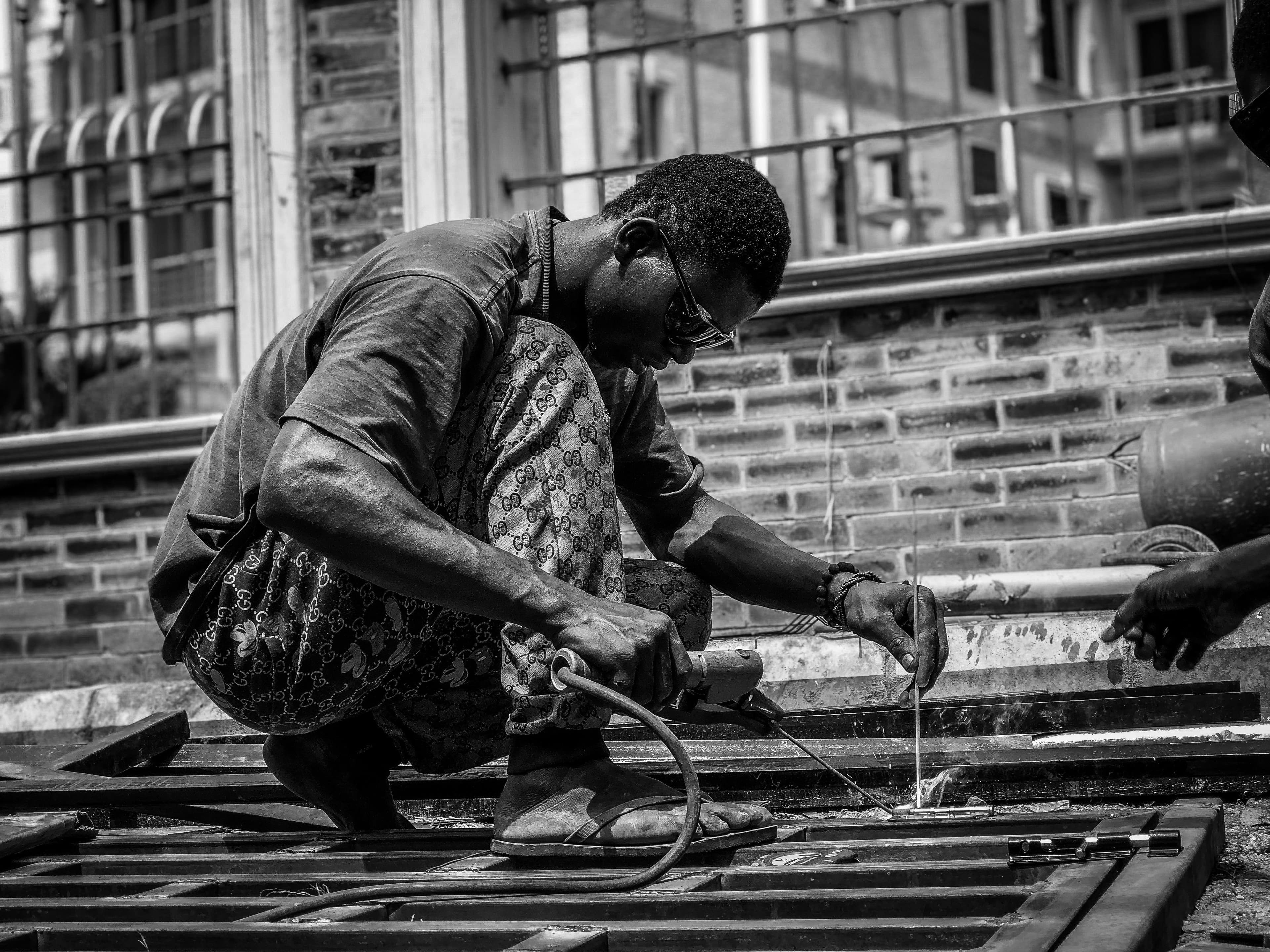 Welder at work in black and white